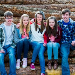 Fun Buckinghamshire outdoor family portraits - children posing for the camera in an Amersham woodland scene