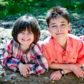 Buckinghamshire outdoor family portraits - children posing for the camera in an Amersham woodland scene