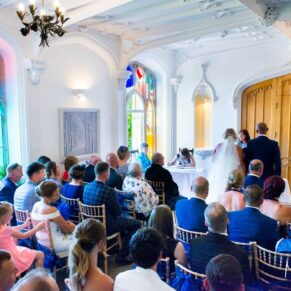 Missenden Abbey wedding images of the ceremony in progress in the Garden Room