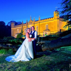 Missenden Abbey wedding images of the newlyweds under the cedar tree at dusk