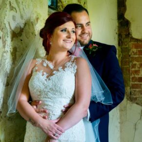 Missenden Abbey wedding celebration - the newlyweds pose in the summerhouse