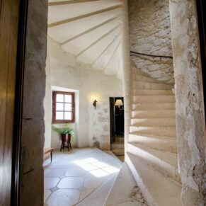 Holiday Homes photography in the UK and France - Chateau Bramatourte interiors showcasing the amazing spiral staircase