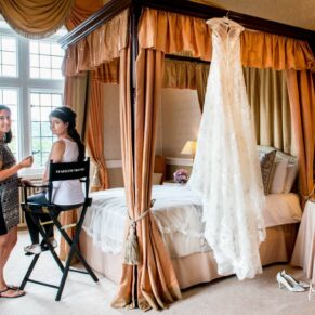 Clearwell Castle wedding image of the bride with her make-up artist on the morning
