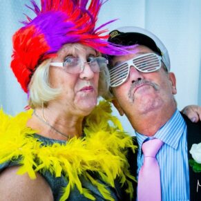 Clearwell Castle wedding images of two colourful characters in the photo-booth