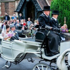 Clearwell Castle - St. Peter's Church wedding photography - the couple in the horses and carriage