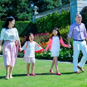 Cliveden House Buckinghamshire portrait photography of a family walking beside the flower borders