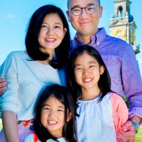 Cliveden House Buckinghamshire portrait photography of family of four with the clocktower behind