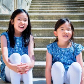 Cliveden House Buckinghamshire portrait photography of two young girls on the steps to the hotel