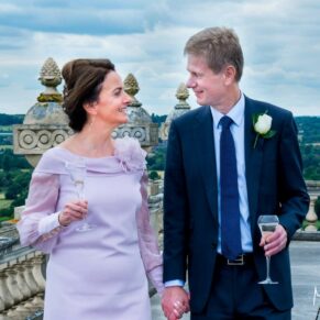 The bride and groom take a stroll at their Cliveden House wedding
