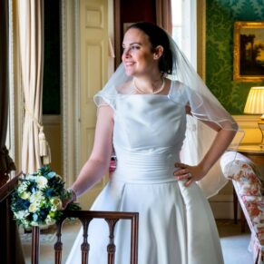 Hartwell House wedding photography of the bride looking through the window