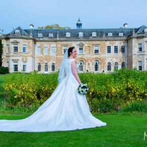 Hartwell House wedding photography of the bride with the hotel behind her