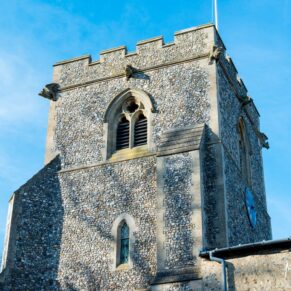 Photography of the exterior of St. John The Baptist Church in Great Gaddesdon on a wintery wedding day