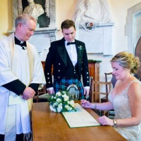 Photography of the signing of the register at St. John The Baptist Church in Great Gaddesdon