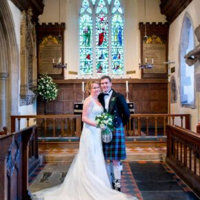 The newlyweds pose for the camera at St. John The Baptist Church in Great Gaddesdon
