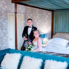 Photography at St Michaels Manor wedding venue in St.Albans of the newlyweds in the master bedroom