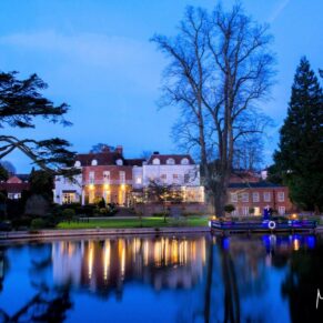 St Michaels Manor wedding venue in St.Albans at dusk across the lake
