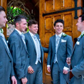 The lads in the doorway at Dairy Waddesdon Manor wedding