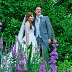The newlyweds in the Secret Garden at their Dairy Waddesdon Manor wedding
