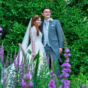 The newlyweds in the Secret Garden at their Dairy Waddesdon Manor wedding