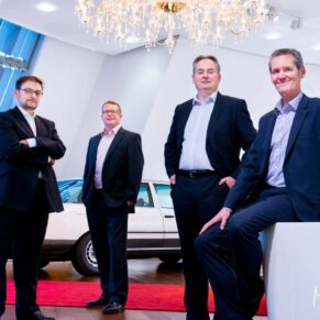 Buckinghamshire business portraits of board of directors in car showroom