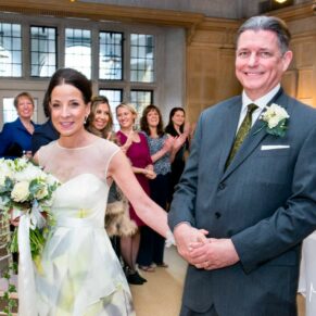 Danesfield House winter wedding photography of the newlyweds exiting the ceremony