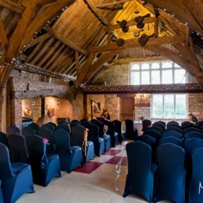 Rustic interior image of barn at Notley Tythe Barn wedding