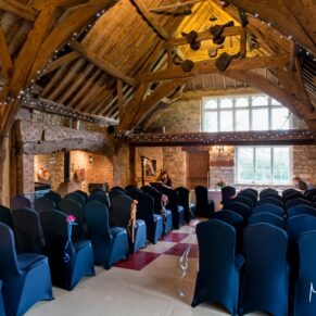 Rustic interior image of barn at Notley Tythe Barn wedding