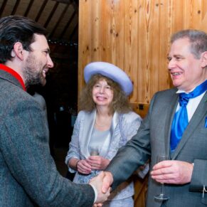 Guests chatting at Notley Tythe Barn wedding