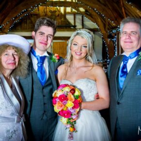 Bride and groom and family at Notley Tythe Barn wedding