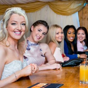 Bride listening to speeches at Notley Tythe Barn wedding