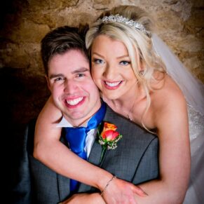 Close-up of bride and groom at Notley Tythe Barn wedding