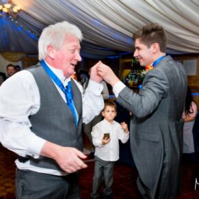 Guests dancing at Notley Tythe Barn wedding