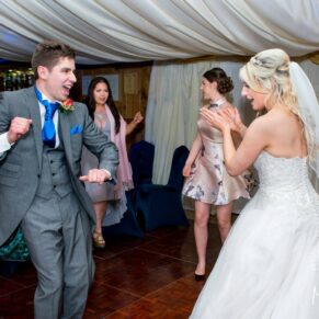 Bride and groom on the dance floor at Notley Tythe Barn wedding