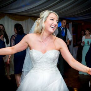 Bride ripping up the dance floor at Notley Tythe Barn wedding