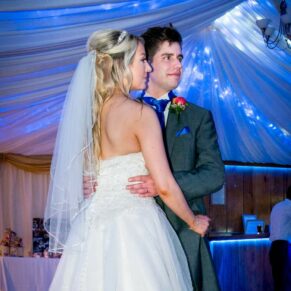 Bride and groom on the dance floor at Notley Tythe Barn wedding