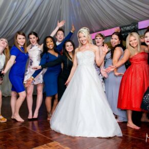 Bride and friends on the dance floor at Notley Tythe Barn wedding