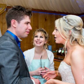 Bride chatting with guest at Notley Tythe Barn wedding
