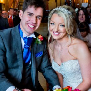Bride and groom after signing the register at Notley Tythe Barn wedding