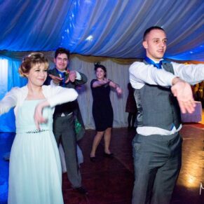 Guests on the dance floor at Notley Tythe Barn wedding
