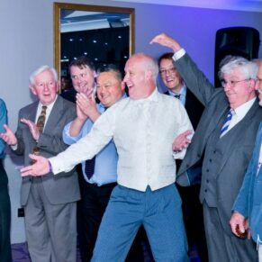 Oakley Court wedding photography of the groom performing with his male voice choir