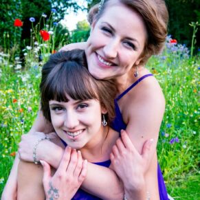 Oakley Court wedding photography of the two bridesmaids embracing