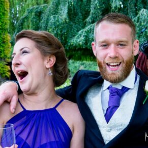 Oakley Court wedding photography of two guests enjoying a candid moment