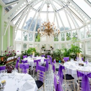 Oakley Court wedding photography of the setup for the meal in the Victorian Glasshouse