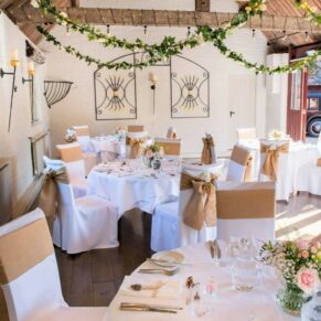 Waddesdon Five Arrows wedding setup for the meal in the Old Coach House