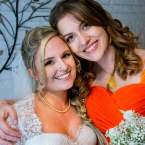 Shot of the bride with her bridesmaid at her Missenden Abbey autumn wedding