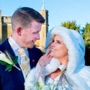 Newlyweds Missenden Abbey autumn wedding pose in the gardens of the abbey