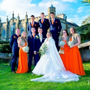 Missenden Abbey autumn wedding pose of the bridal party under the cedar tree