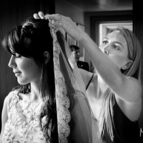 Dairy Waddesdon wedding photographs of the veil being adjusted before the ceremony