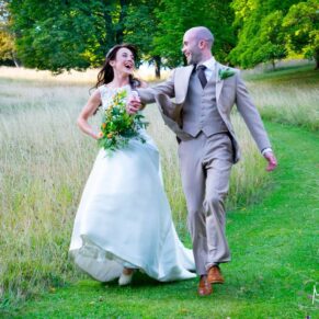 Dairy Waddesdon wedding photographs of the newlyweds running