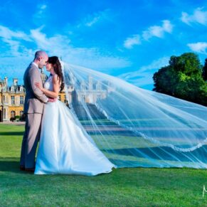 Dairy Waddesdon wedding photographs of the newlyweds under a perfect blue sky